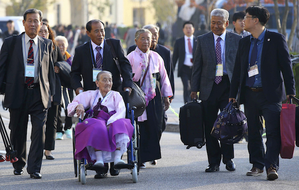 South Korean elderly people leave for North Korea to take part in family reunions with their North Korean family members at a hotel in Sokcho, South Korea, Tuesday, Oct. 20, 2015. About 640 South Koreans will be reunited with their North Korean relatives at the Diamond Mountain in North Korea from Oct. 20 to 26. (Kim Do-hoon/Yonhap via AP) KOREA OUT