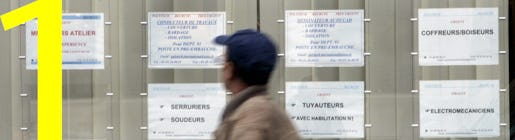 A passer by walks past the window of an temporary employment agency in Paris, Monday Sept. 29, 2008. The month of August has seen another 30,000 to 40,000 job seekers as French economy shrunk by 0.3 percent in the second quarter of 2008.(AP Photo/Remy de la Mauviniere)
