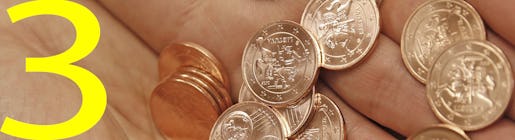 A salesperson presents Euro coins in a shop in Vilnius, Lithuania, Thursday, Jan. 1, 2015. The Baltic state of Lithuania early Thursday became the 19th European Union member to adopt the joint European currency, the euro. (AP Photo/Mindaugas Kulbis)