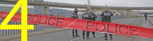 Police officers cordon off the access to the Orly airport, south of Paris, Saturday, March, 18, 2017. A man was shot to death Saturday after trying to seize the weapon of a soldier guarding Paris' Orly Airport, prompting a partial evacuation of the terminal, police said. Authorities warned visitors to avoid the area while an ongoing police operation was underway. (AP Photo/Thibault Camus)