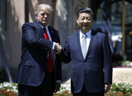 President Donald Trump and Chinese President Xi Jinping shake hands after a bilateral meeting at Mar-a-Lago, Friday, April 7, 2017, in Palm Beach, Fla. Trump was meeting again with his Chinese counterpart Friday, with U.S. missile strikes on Syria adding weight to his threat to act unilaterally against the nuclear weapons program of China's ally, North Korea.(AP Photo/Alex Brandon)