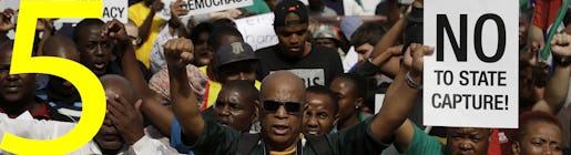 Demonstrators protest against South African President Jacob Zuma outside the union building in Pretoria, South Africa, Friday, April 7, 2017. South Africans are gathering for nationwide demonstrations against Zuma, whose dismissal of the finance minister fueled concerns over government corruption and economic weakness. (AP Photo/Themba Hadebe)