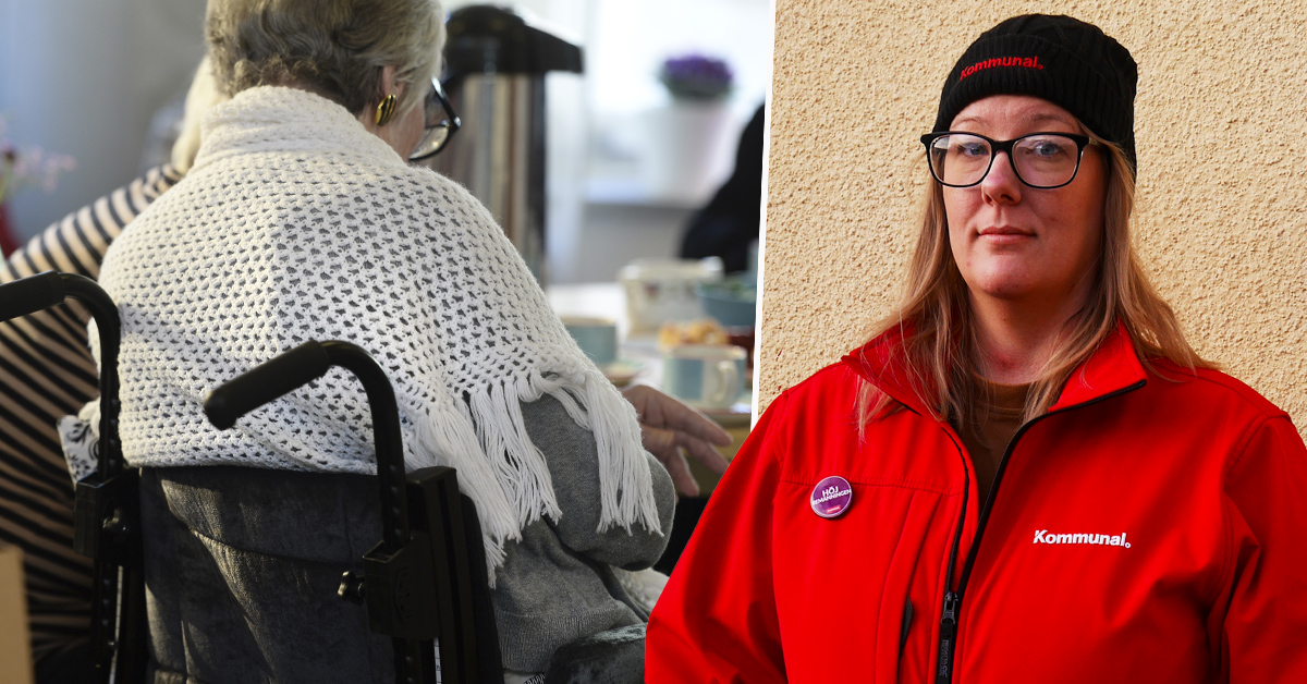 En kvinna i rullstol täckt med en vit sjal bredvid en person som bär en röd Kommunal-jacka och hatt, stående intill en vägg.