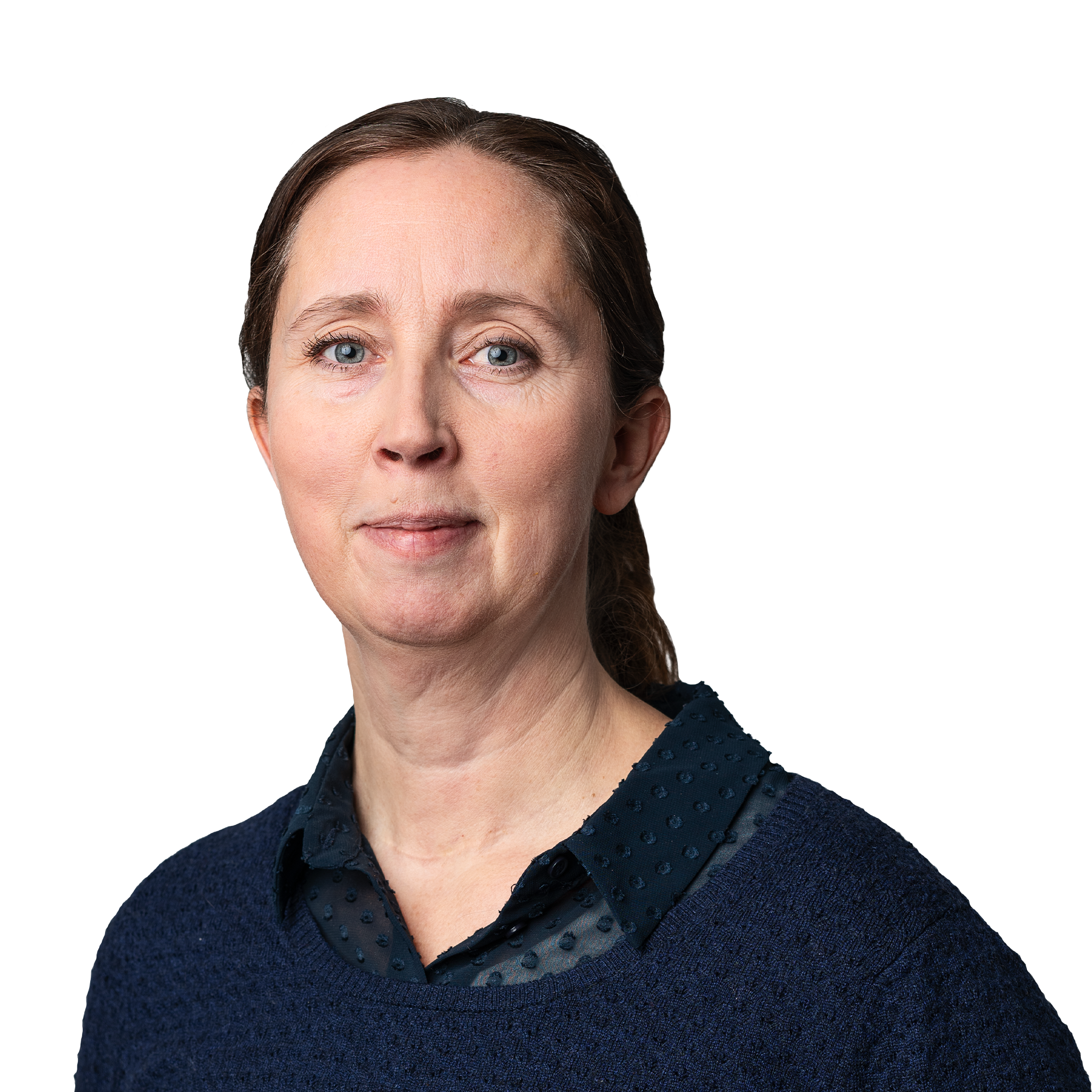 Helena Gunnarsson i blå skjorta och brunt hår i tofs bakom huvudet.