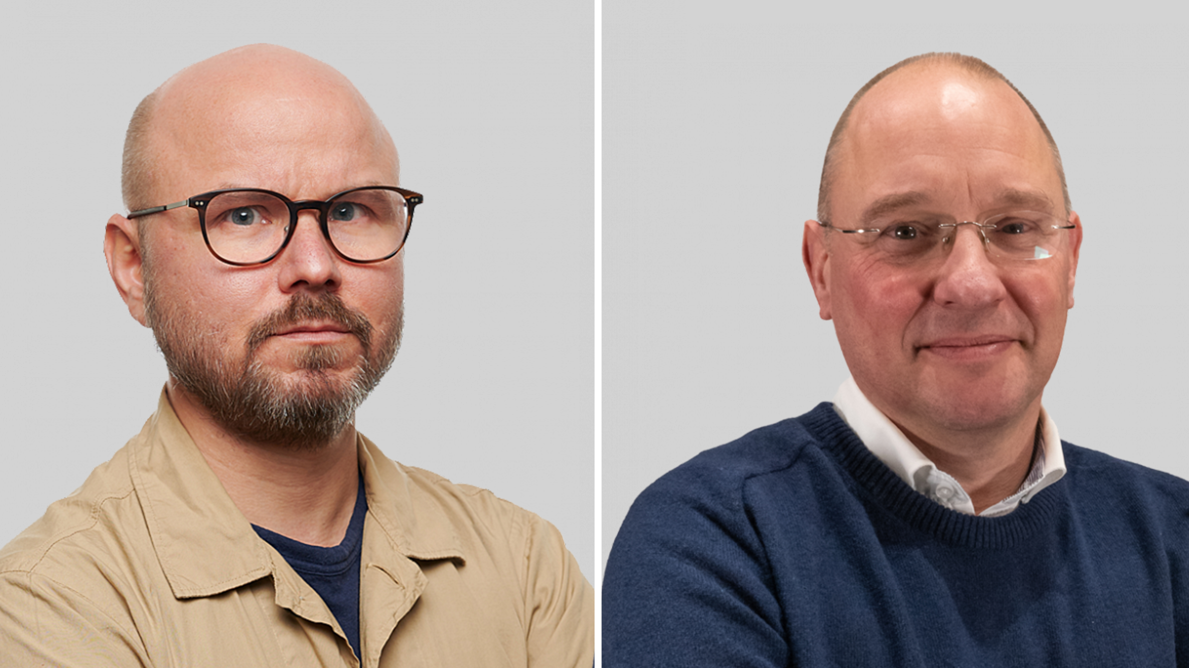 Två män med glasögon ser mot kameran.