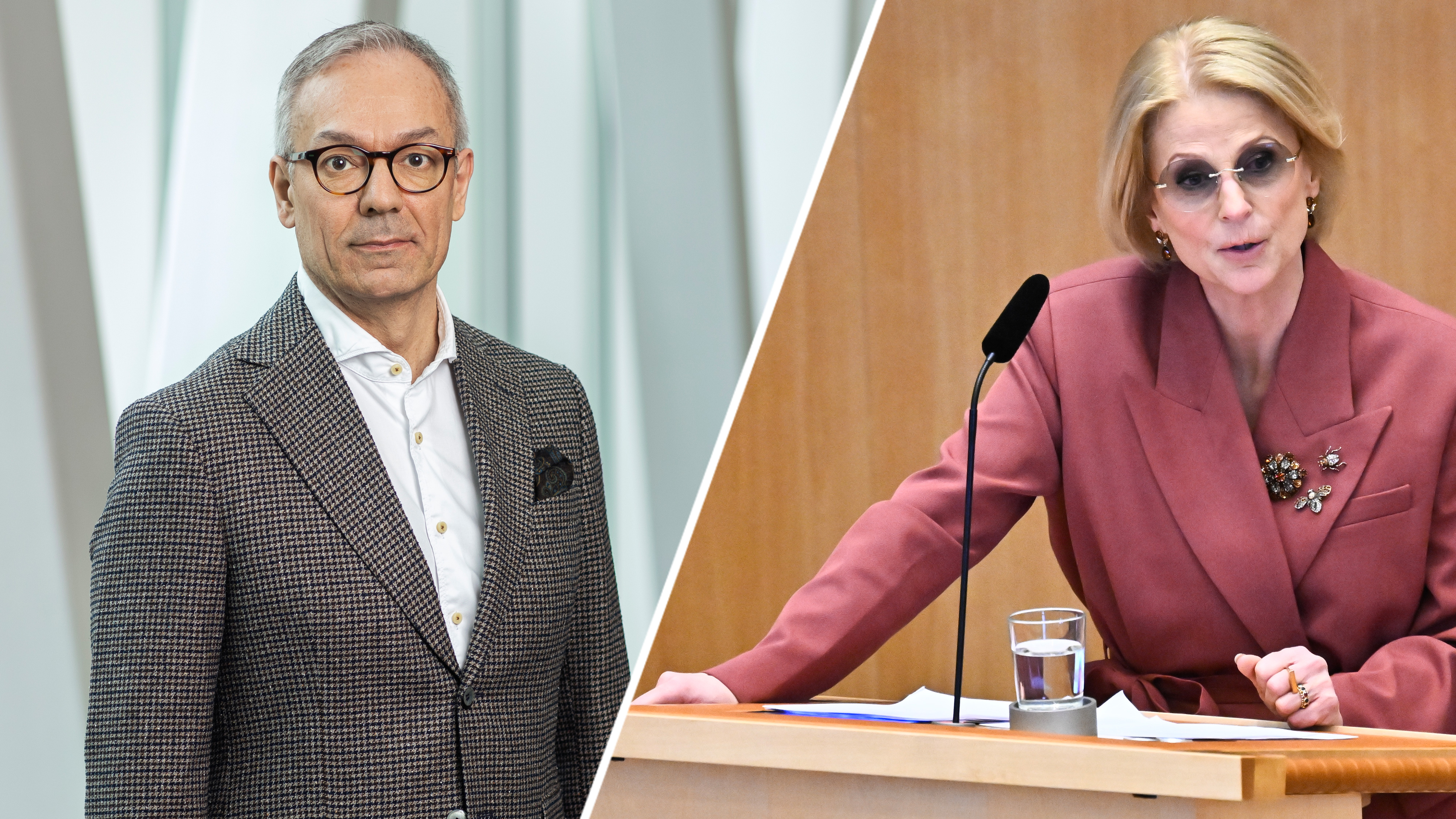 En man i rutig kostym står inomhus, bredvid honom talar en kvinna i rosa kavaj vid ett podium med mikrofon och vattenglas.