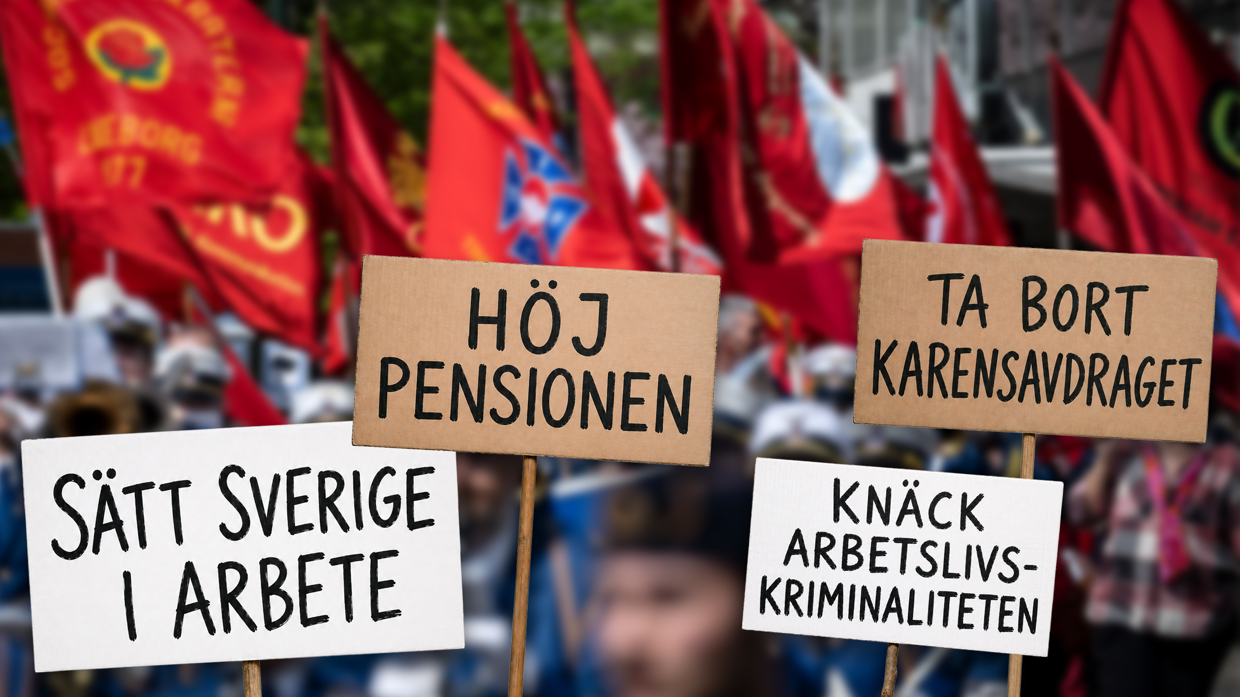 Demonstranter höll plakat som uppmanade till ökade pensioner, ett slut på pensionsförmåner, en minskning av arbetslösheten och åtgärder för att bekämpa brottslighet på arbetsplatsen. Skylten har en illustration och en röd flagga från ett faktiskt första maj-tåg kan ses i bakgrunden.