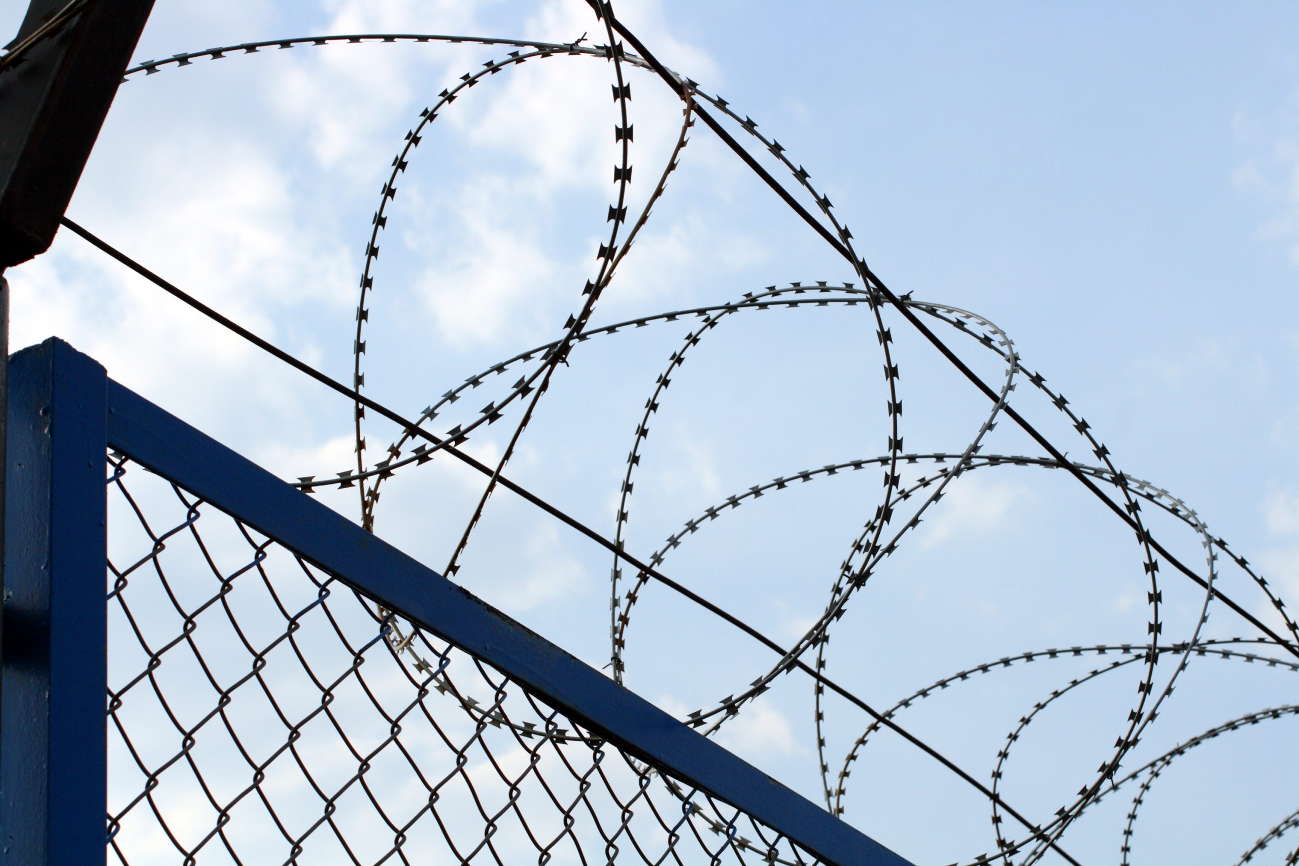 257135-fence-with-barbed-wire-close-up