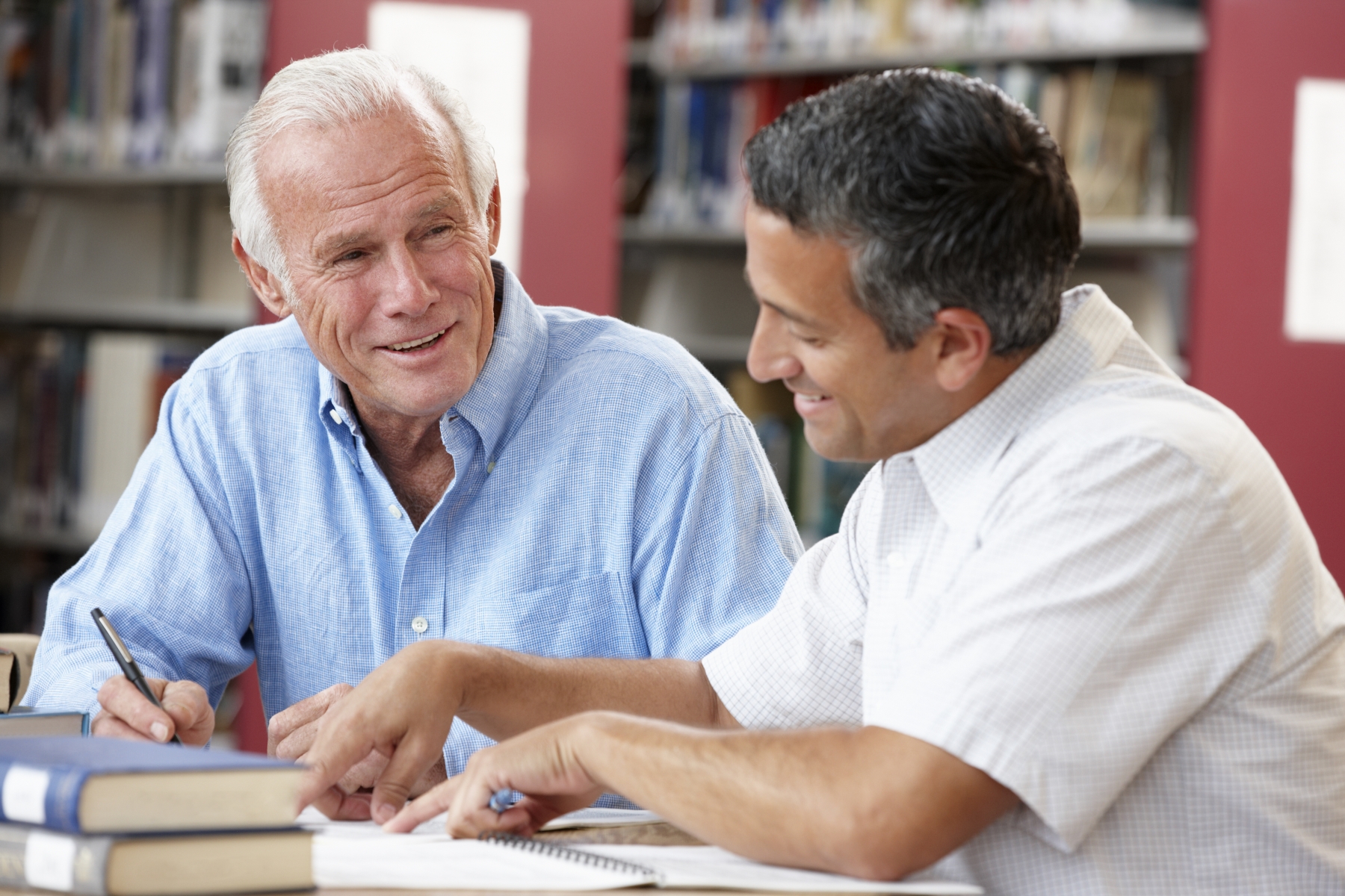 12116664-mature-students-working-in-library