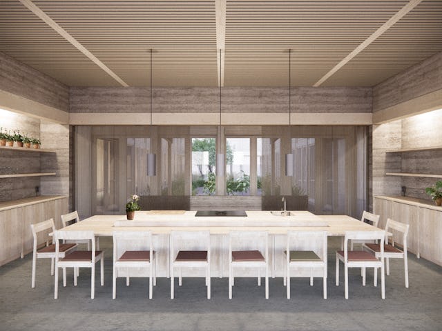 Minimalistisk kök med ett långt bord i trä, vita stolar, hängande lampor och stora fönster mot en trädgård. Hyllor med krukväxter längs väggarna.