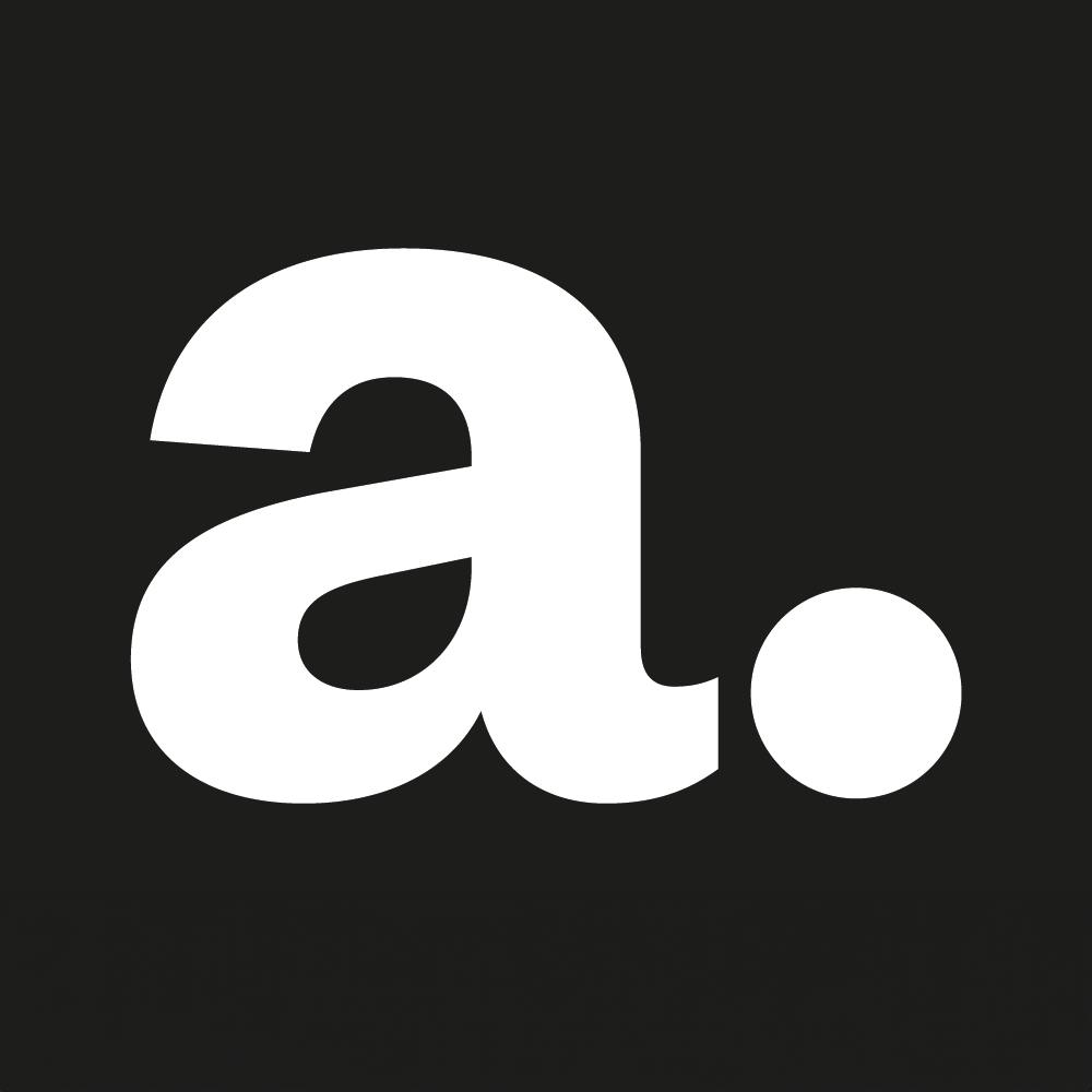 Liten vit bokstav "a" med en punkt på en svart bakgrund.