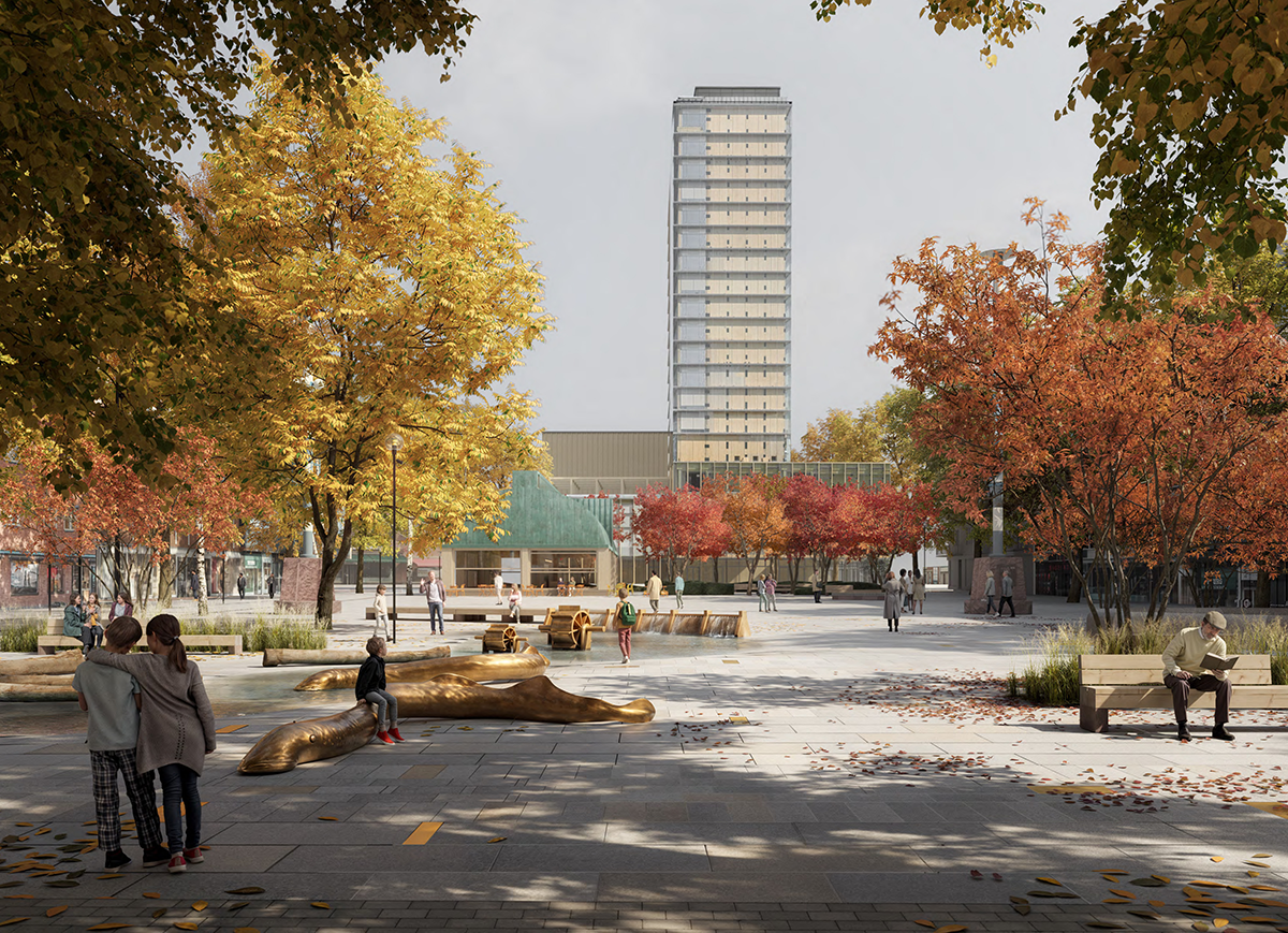 Personer går och sitter i en stadspark med träd och löv på marken. Bänkar, konstverk och en hög byggnad syns bakom.