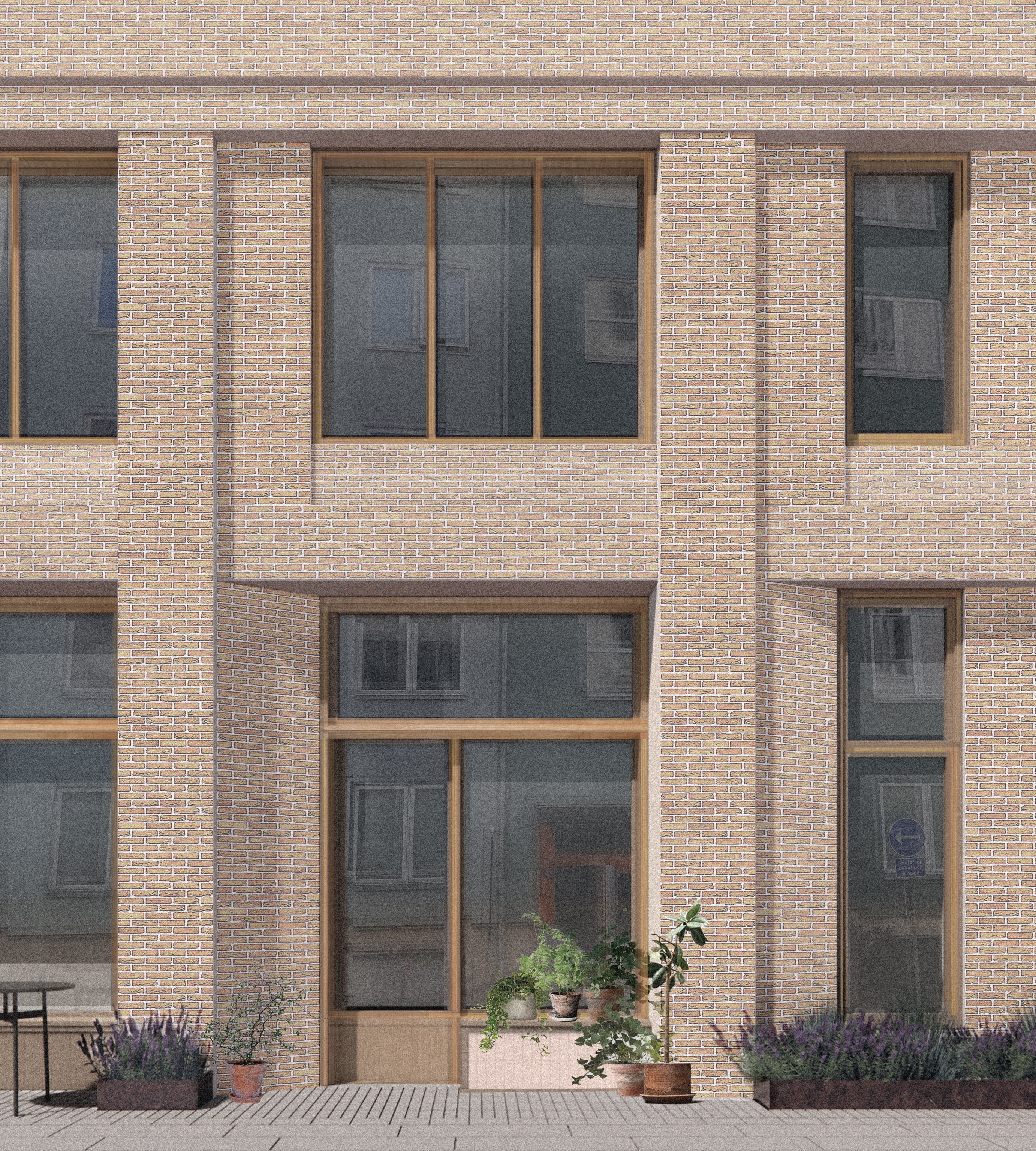 En tegelbyggnadsfasad med stora glasfönster, trädetaljer och flera krukväxter placerade vid ingången på trottoaren.